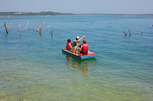 homemade wooden scow floating